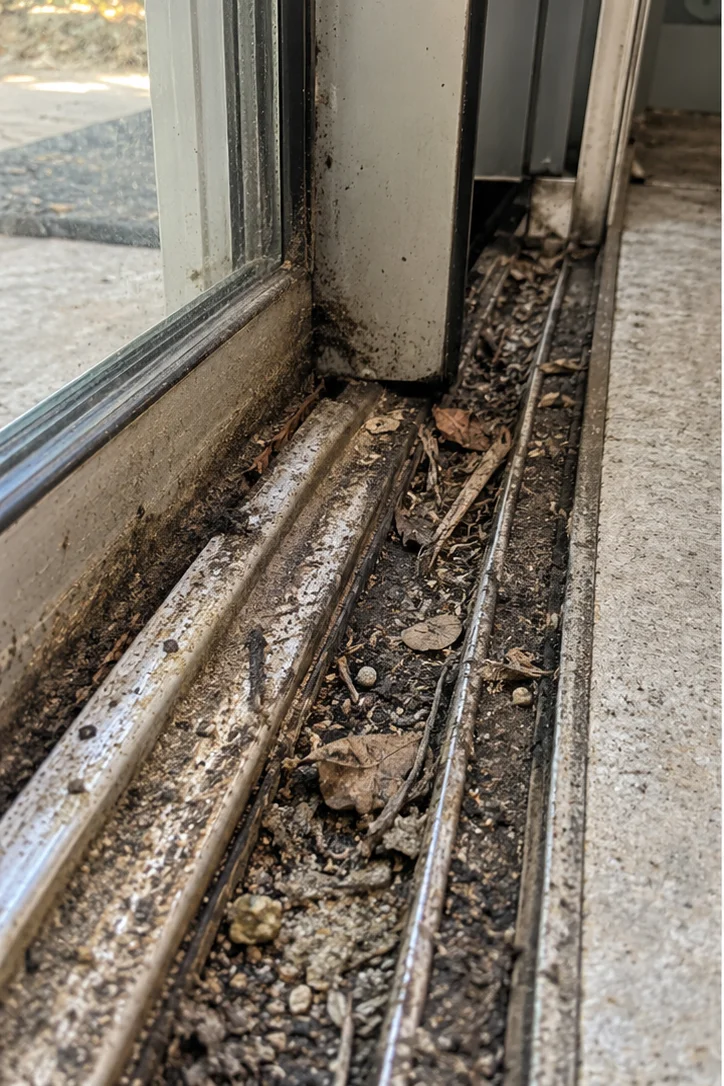 Sliding door with hurricane damage before repair