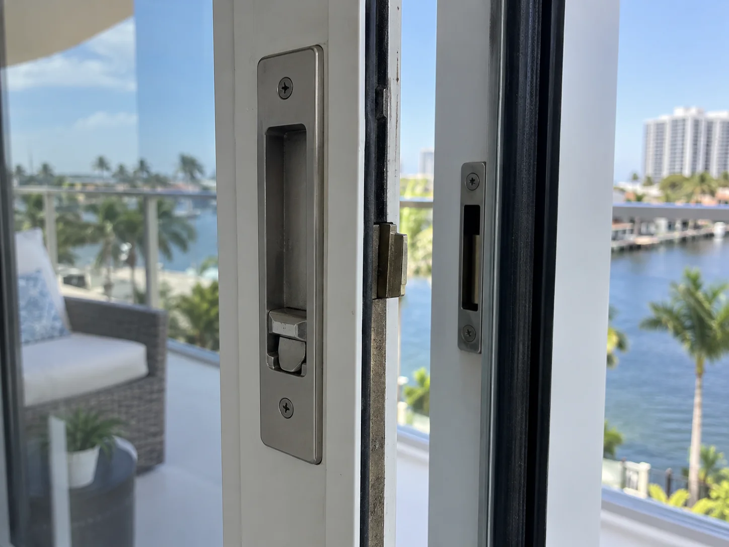 Technician repairing a sliding door lock