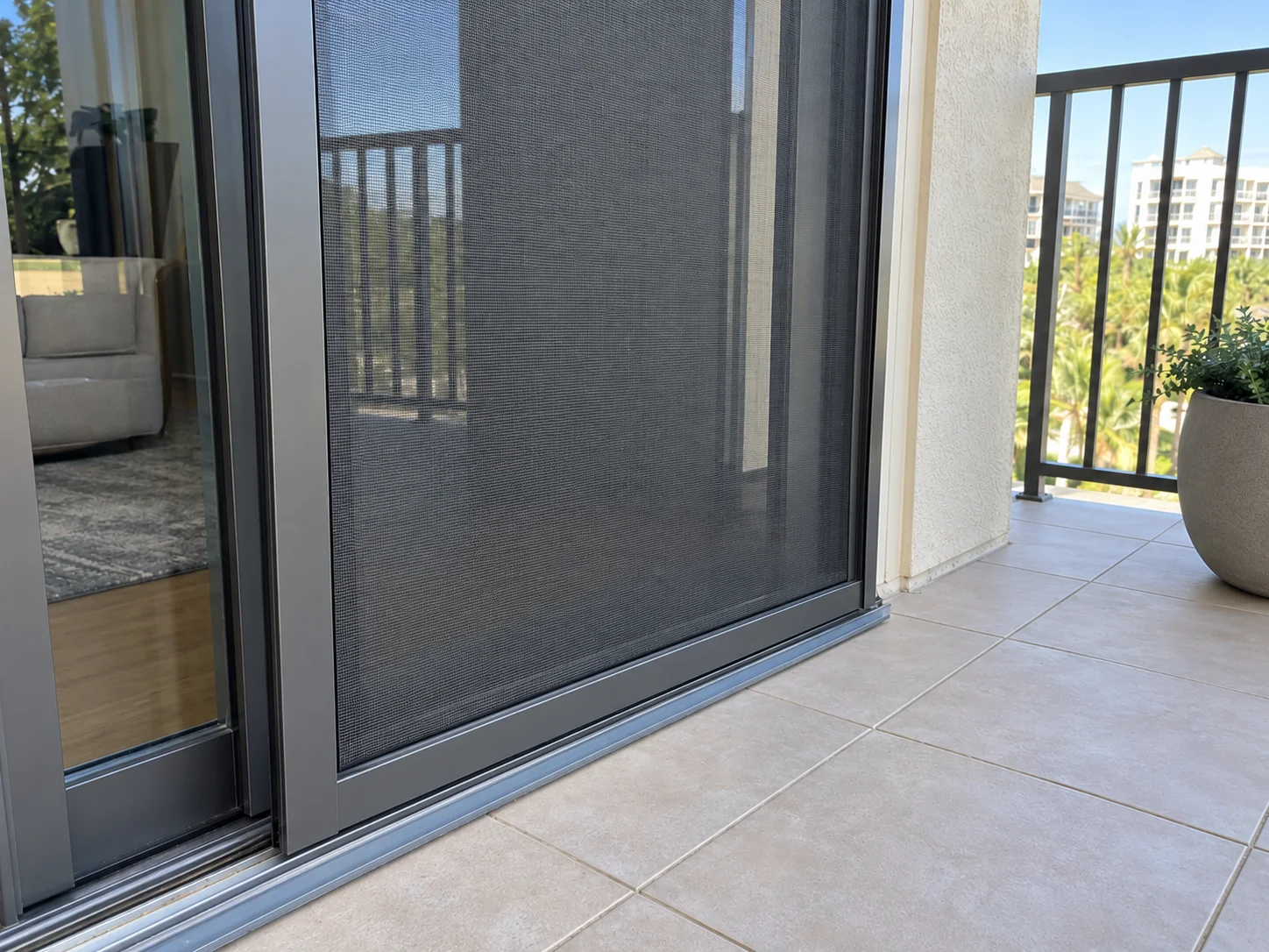 After: new intact sliding screen door installed on same balcony